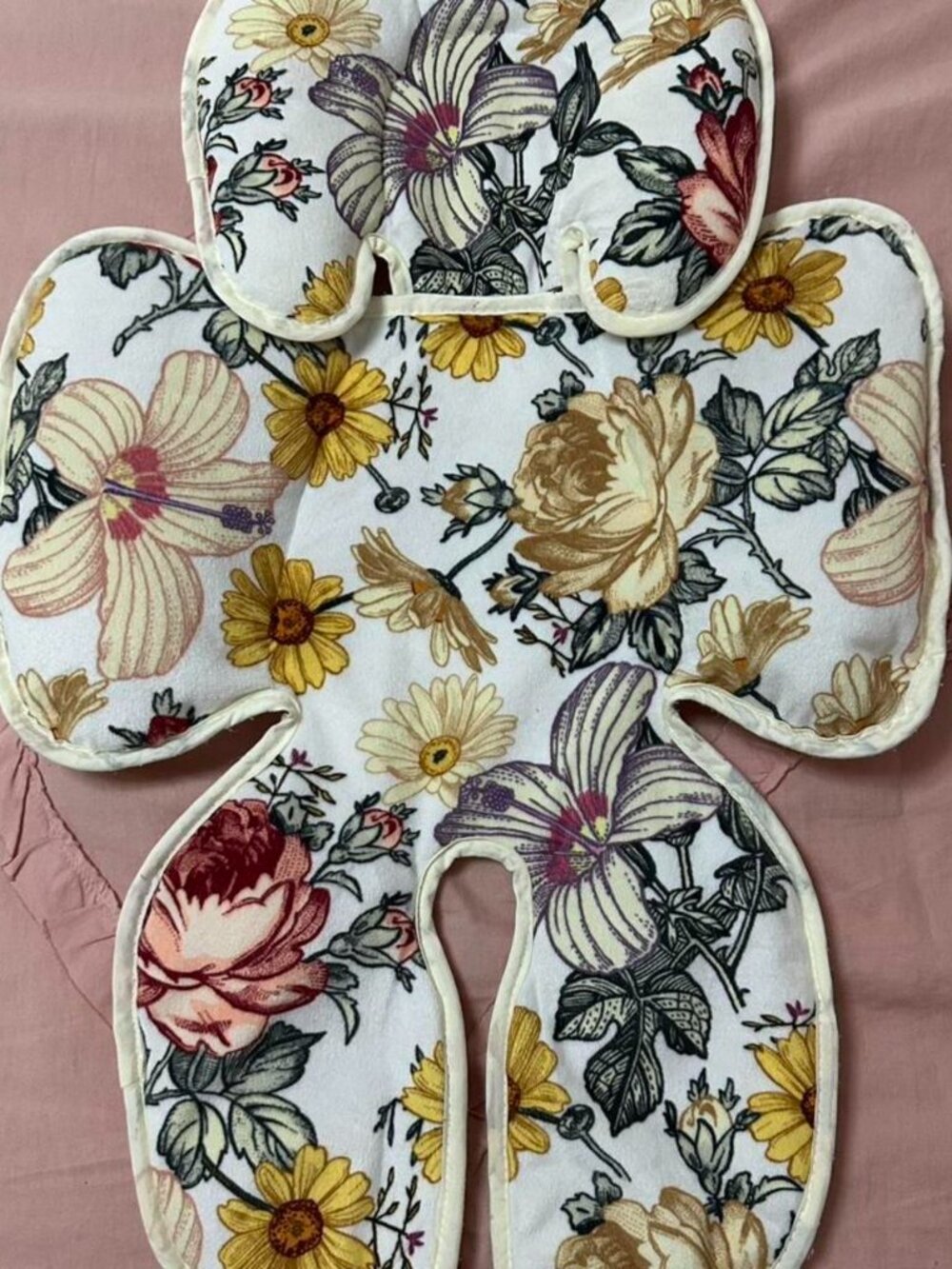 Floral reversible baby support insert with detachable head support.